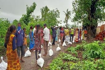 People maintain social distancing norms