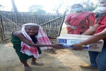 A marginalised family receives their share of the kit.