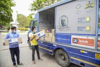 Akshaya Patra’s distribution van is filled with grocery kits to help marginalised communities.
