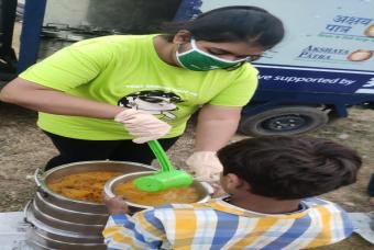 A child receives dal to begin his day without the worry of food