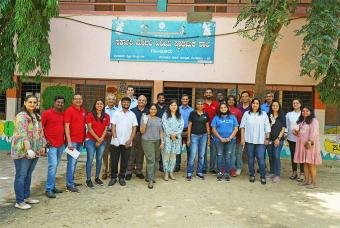 Volunteers painting blackboards for two reasons – to break the record and to aid children in the journey of education.